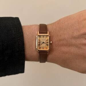 2000s vintage style rectangular gold luxury watch with leather band